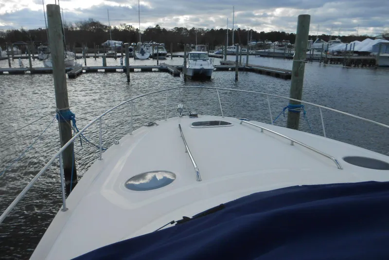 Slide: The Image of 2005 Sea Ray 340 Sundancer yacht docked at marina, view from bow. - 2