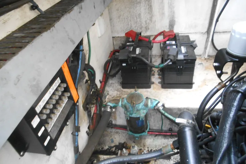Slide: The Image of Engine compartment of a 2005 Sea Ray 340 Sundancer with batteries and wiring. - 20