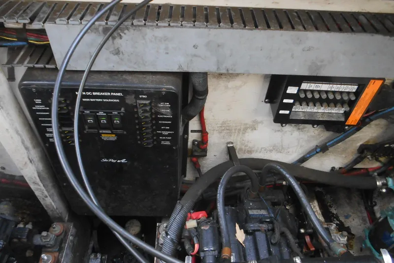Slide: The Image of Electrical panel and wiring in a 2005 Sea Ray 340 Sundancer boat engine room. - 21