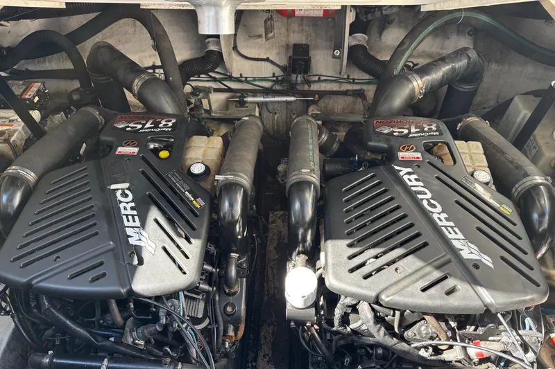 Slide: The Image of Twin Mercury engines in a 2005 Sea Ray 340 Sundancer boat engine compartment. - 24