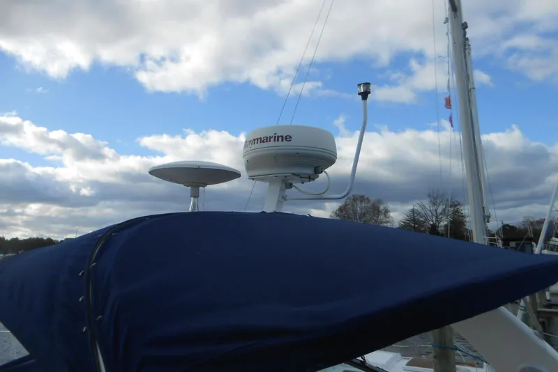 Slide: The Image of Radar equipment on a 2005 Sea Ray 340 Sundancer against a cloudy sky. - 4