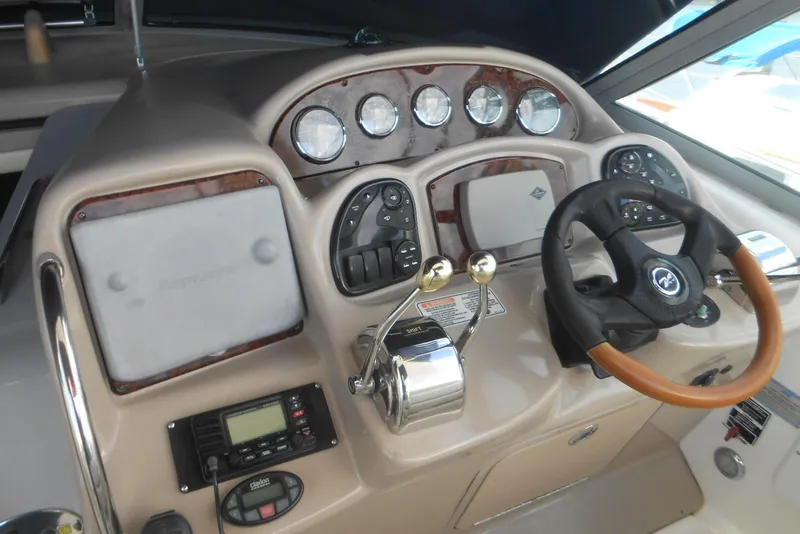 Slide: The Image of Helm of 2005 Sea Ray 340 Sundancer with steering wheel and control panel. - 6