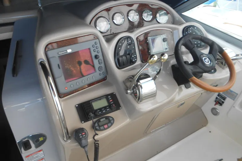 Slide: The Image of Control panel of a 2005 Sea Ray 340 Sundancer boat with navigation equipment. - 7