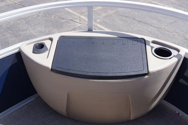 Slide: The Image of 2025 Sun Tracker Bass Buggy 18 DLX boat console with cup holders and storage. - 17