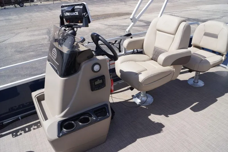 Slide: The Image of 2025 Sun Tracker Bass Buggy 18 DLX interior with steering console and comfortable seating. - 20