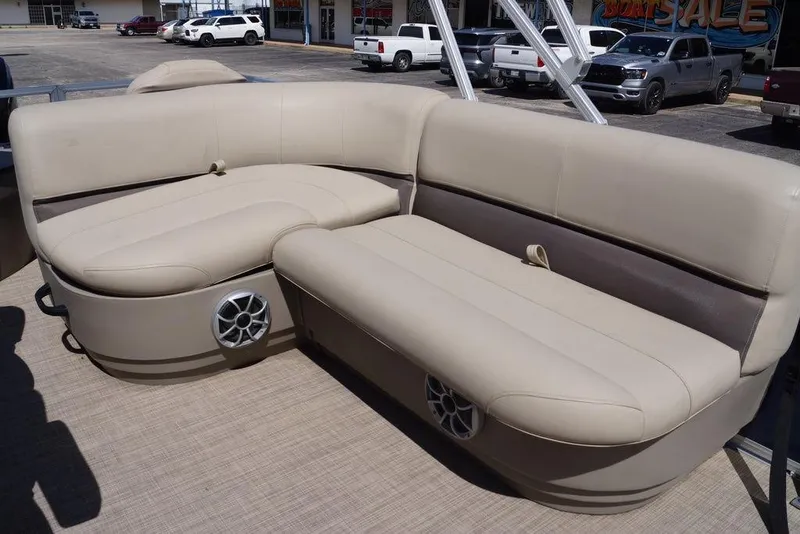 Slide: The Image of 2025 Sun Tracker Bass Buggy 18 DLX pontoon boat seating with built-in speakers. - 21