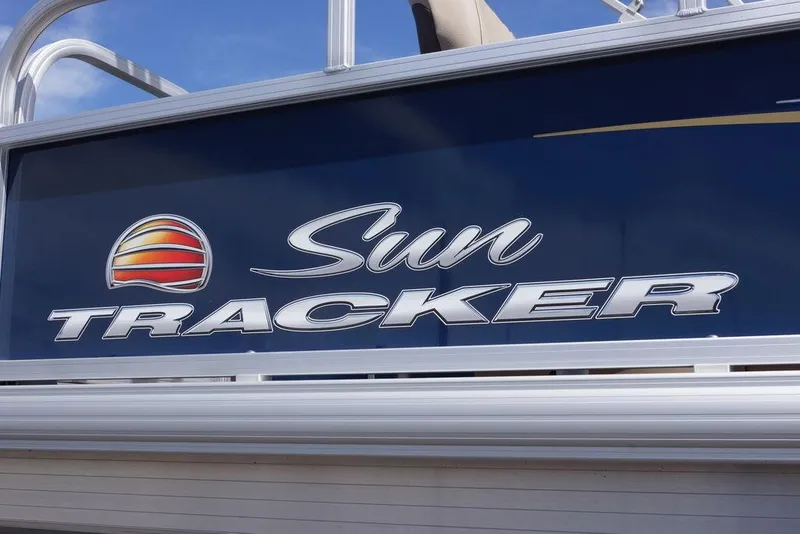 Slide: The Image of Sun Tracker Bass Buggy 18 DLX 2025 logo on boat exterior. - 3