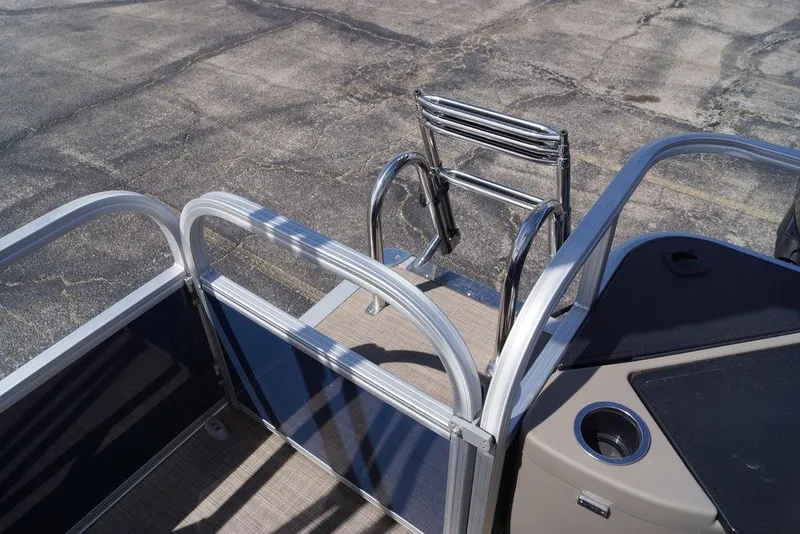 Slide: The Image of 2025 Sun Tracker Bass Buggy 18 DLX pontoon boat with rear entry ladder. - 8