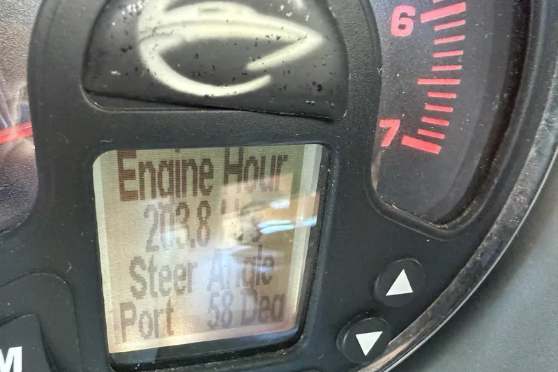 Slide: The Image of Dashboard of 2013 Crownline 285 SS showing engine hours and steer angle. - 10