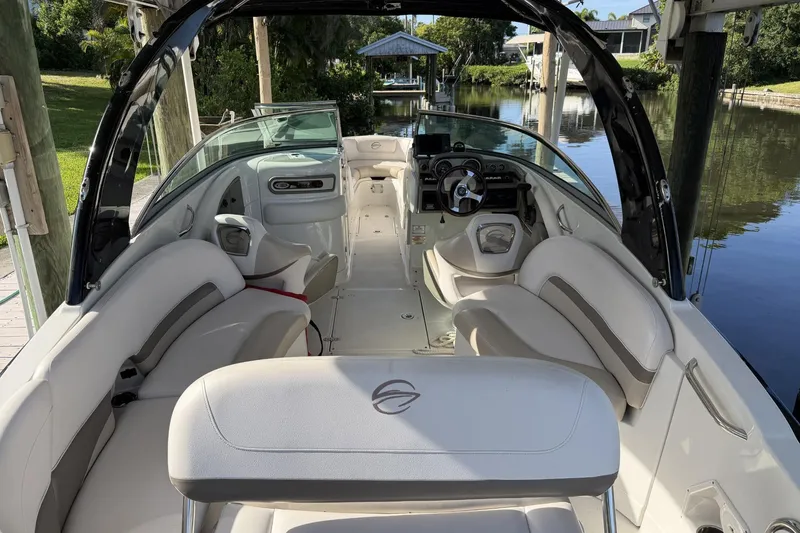Slide: The Image of 2013 Crownline 285 SS boat interior with plush seating and sleek design. - 3