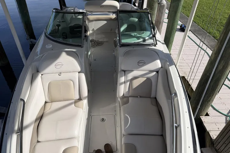 Slide: The Image of 2013 Crownline 285 SS boat with spacious seating and sleek design. - 5
