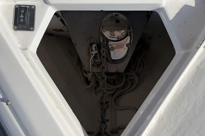 Slide: The Image of Anchor compartment of 2013 Crownline 285 SS boat with windlass control and rope storage. - 8