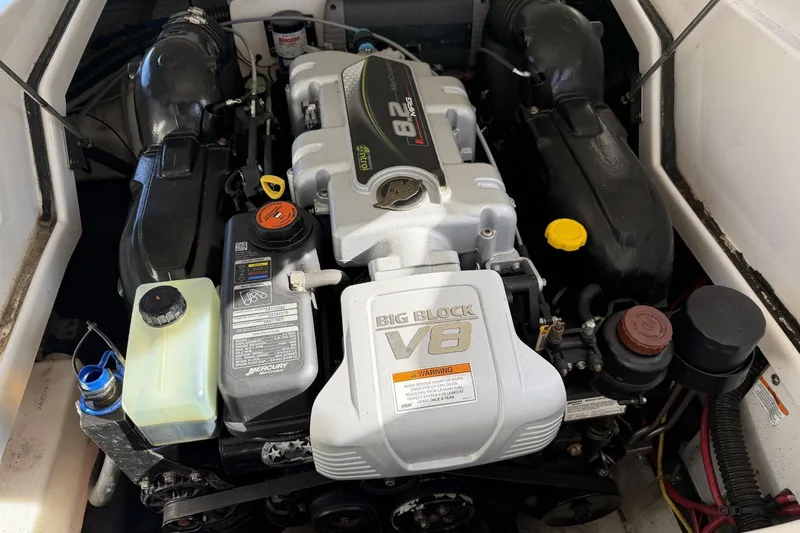 Slide: The Image of Engine compartment of a 2013 Crownline 285 SS boat with a Big Block V8 engine. - 9