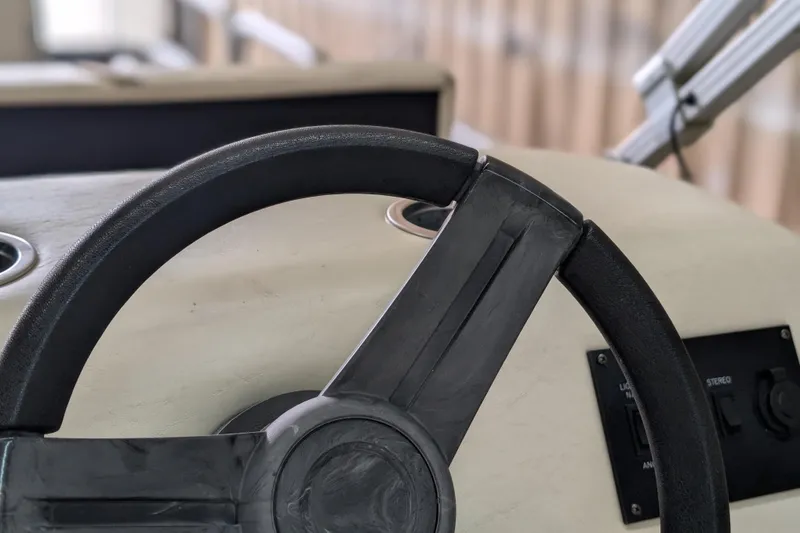Slide: The Image of Steering wheel of a 2016 SunChaser Oasis Fish 816 boat, close-up view. - 10