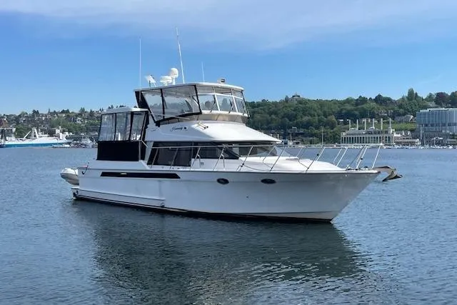 The Image of 1993 Ocean Alexander 440 Sundeck CPMY yacht on calm water, scenic background. - 0
