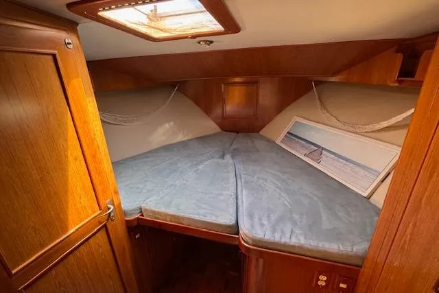 Slide: The Image of 1993 Ocean Alexander 440 Sundeck CPMY cabin with cozy bed and nautical decor. - 32