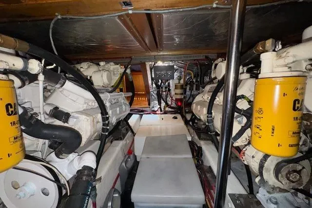 Slide: The Image of Engine room of 1993 Ocean Alexander 440 Sundeck CPMY with visible machinery and components. - 33