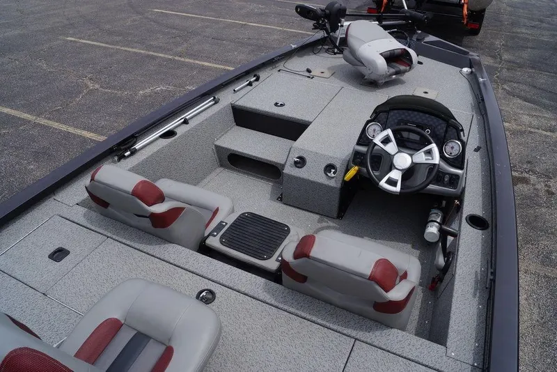 Slide: The Image of 2023 G3 Sportsman 1710 boat interior with steering wheel and seating. - 2