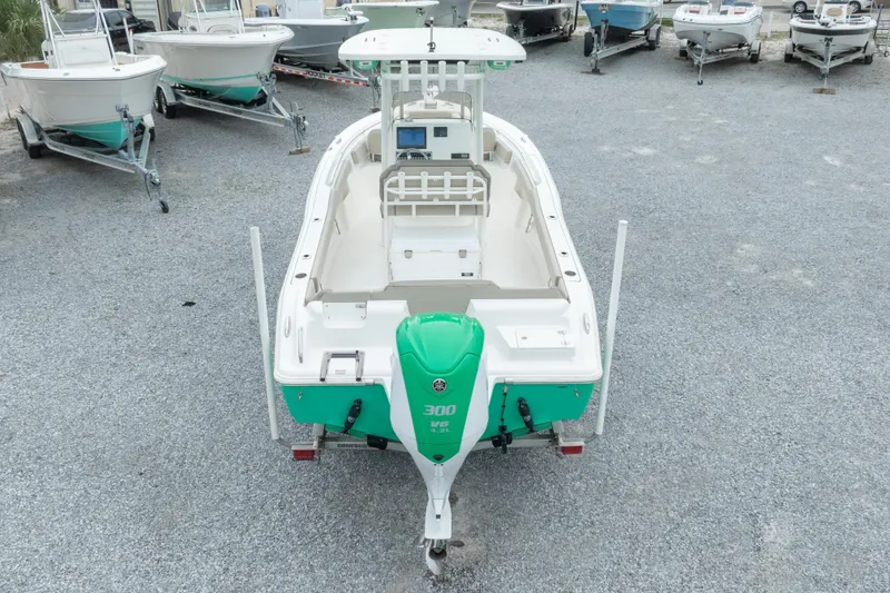 Slide: The Image of 2023 Key West 239 FS boat with Yamaha 300 HP engine, displayed in a gravel lot. - 12