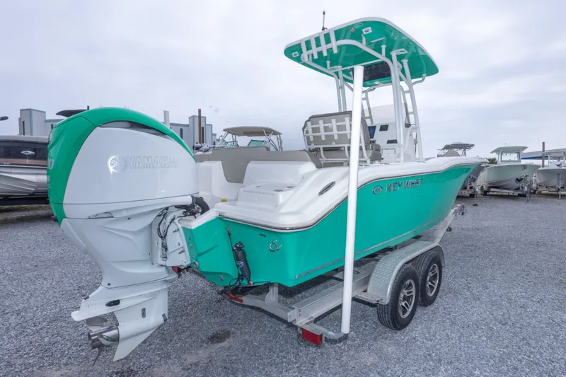 Slide: The Image of 2023 Key West 239 FS boat with Yamaha engine on trailer. - 13