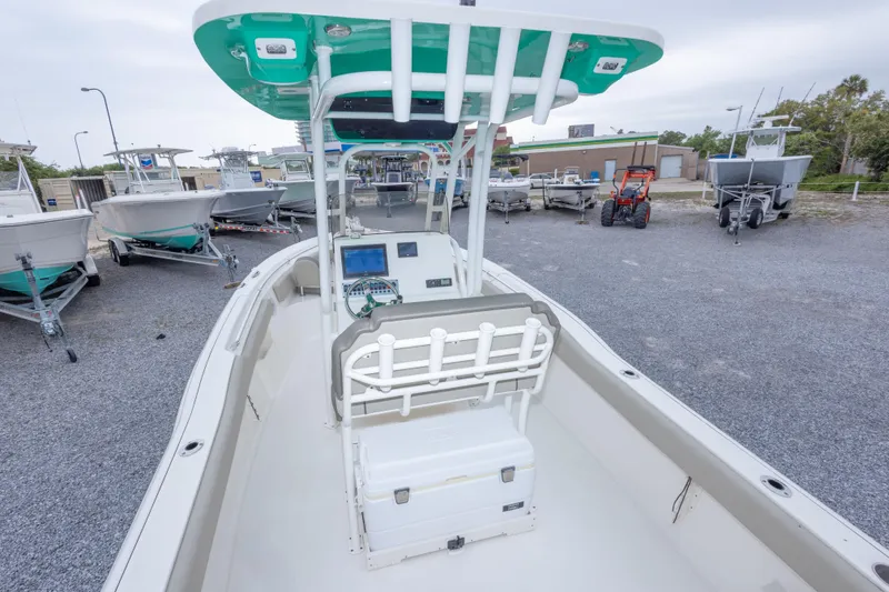 Slide: The Image of 2023 Key West 239 FS boat with center console, parked on gravel lot. - 20