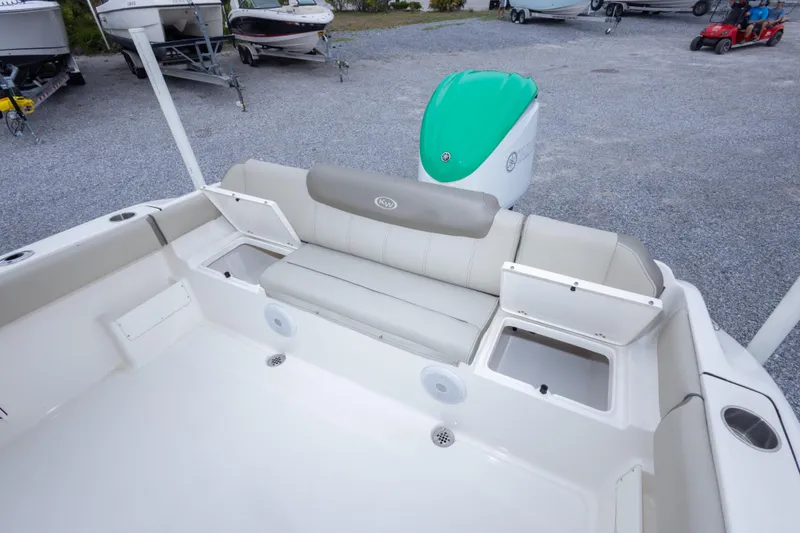 Slide: The Image of 2023 Key West 239 FS boat interior with seating and storage compartments. - 27