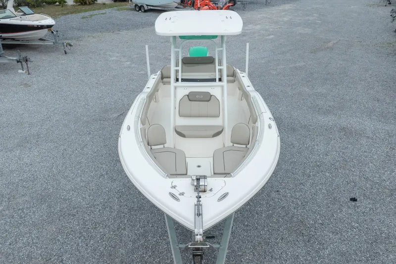 Slide: The Image of 2023 Key West 239 FS boat, aerial view, parked on gravel lot. - 3