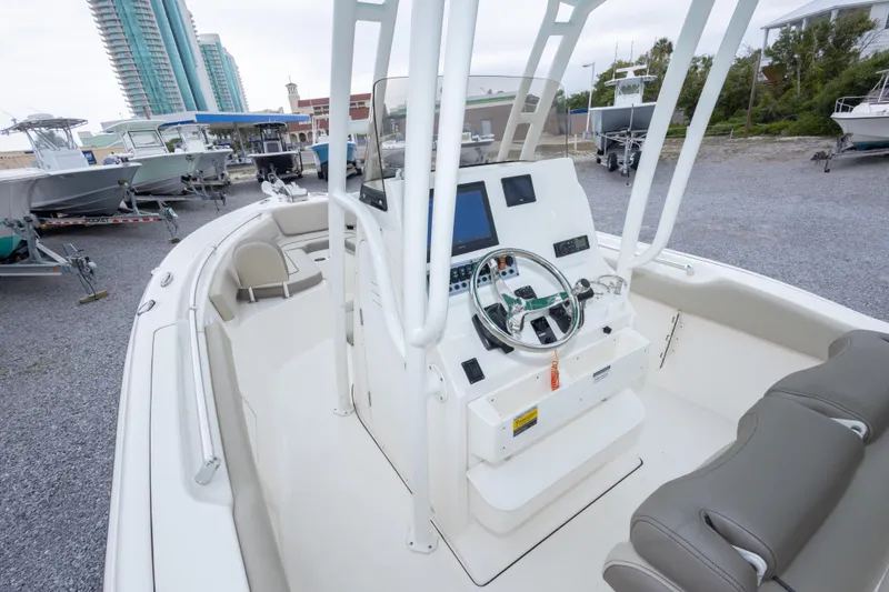 Slide: The Image of 2023 Key West 239 FS boat interior with modern console and seating. - 30