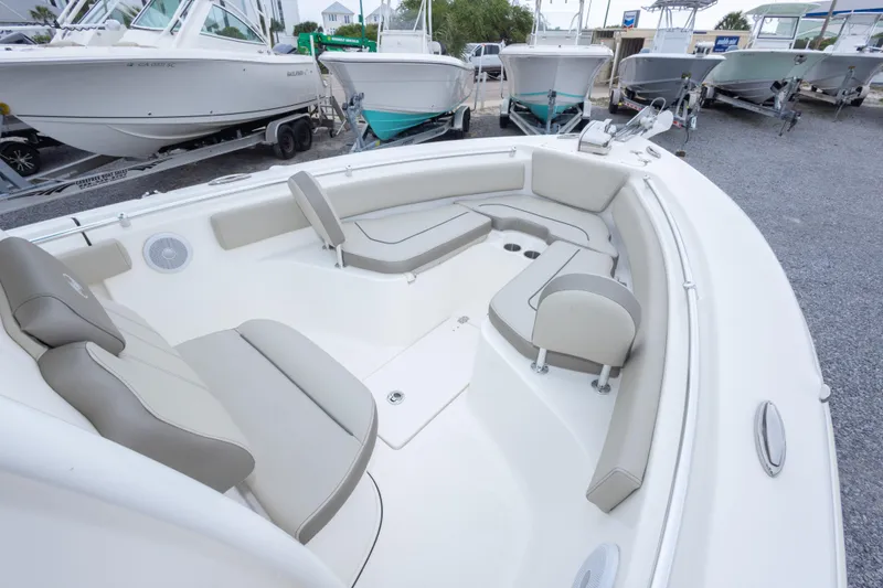 Slide: The Image of 2023 Key West 239 FS boat interior with cushioned seating and sleek design. - 32