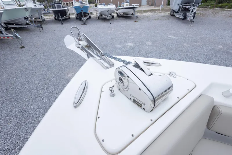 Slide: The Image of 2023 Key West 239 FS boat anchor system on display in a gravel lot. - 37