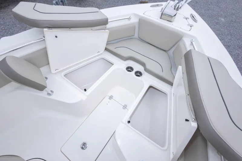Slide: The Image of 2023 Key West 239 FS boat interior with cushioned seating and storage compartments. - 40