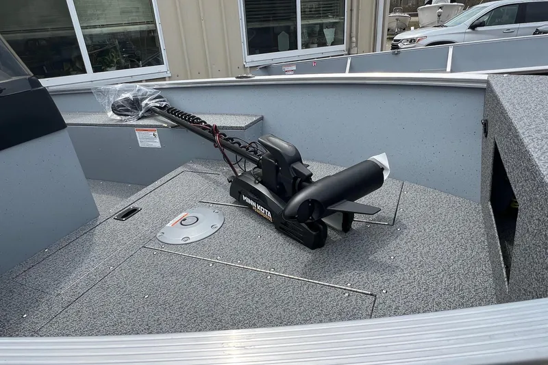 Slide: The Image of 2026 Lund 1400 Fury SS boat deck with Minn Kota trolling motor. - 11