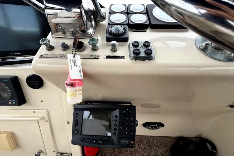 Slide: The Image of Control panel of a 1989 45' Californian Aft Cabin Motor Yacht with navigation instruments. - 17