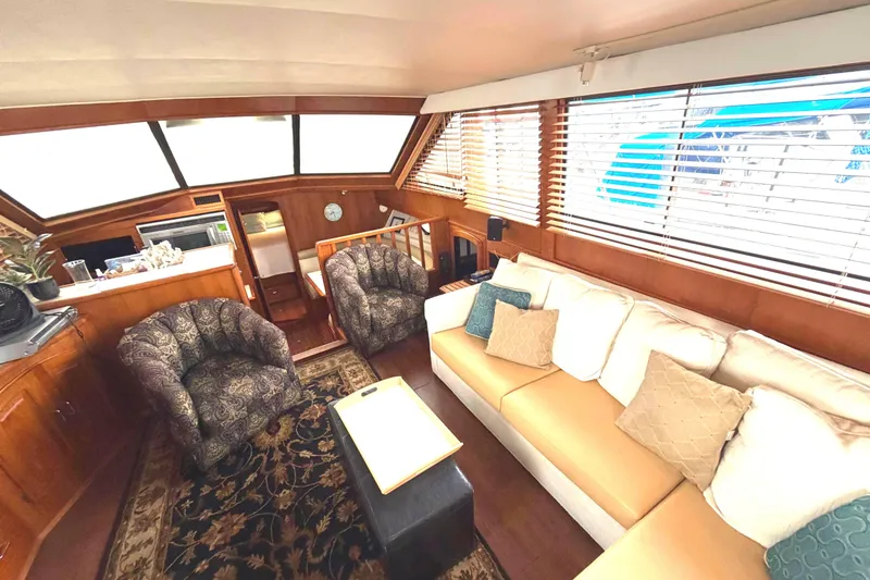 Slide: The Image of Luxurious interior of 1989 45' Californian Aft Cabin Motor Yacht with plush seating and elegant decor. - 21