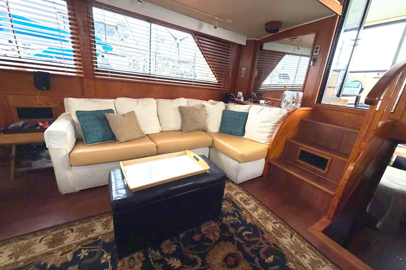 Slide: The Image of Luxurious interior of 1989 45' Californian Aft Cabin Motor Yacht with cozy seating and elegant decor. - 22