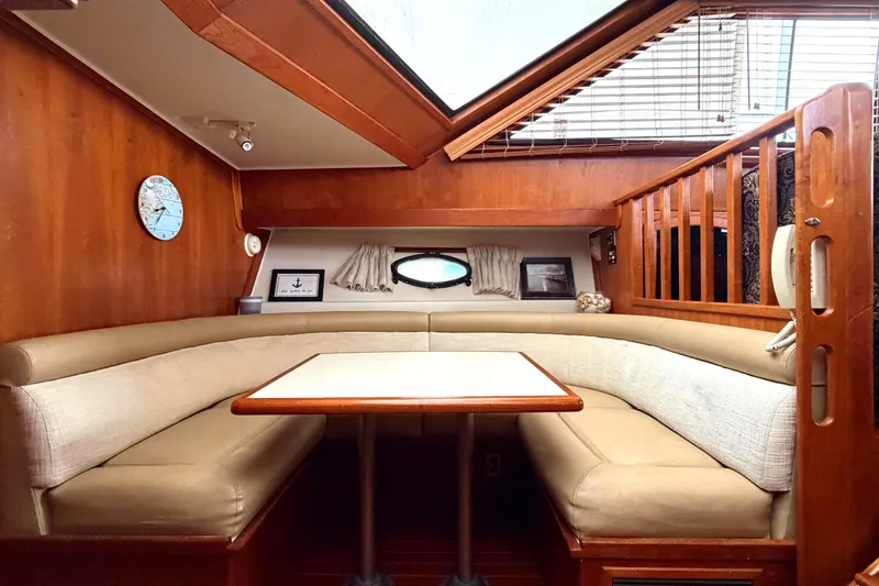 Slide: The Image of Interior of 1989 45' Californian Aft Cabin Motor Yacht with cozy dining area. - 31