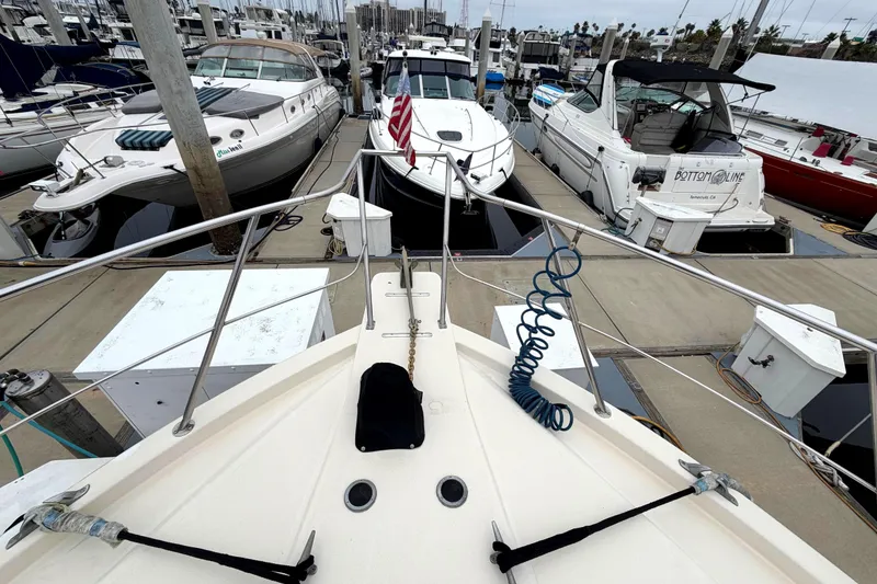 Slide: The Image of 1989 45' Californian Aft Cabin Motor Yacht docked among other boats in marina. - 4