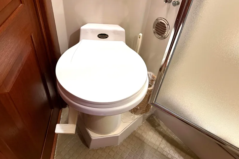 Slide: The Image of Toilet in 1989 45' Californian Aft Cabin Motor Yacht bathroom, featuring a foot pedal flush. - 46