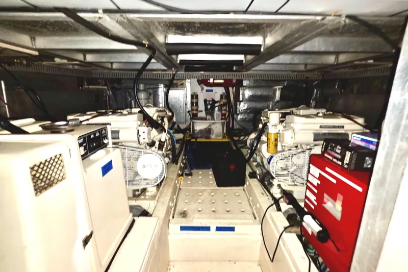 Slide: The Image of Engine room of 1989 45' Californian Aft Cabin Motor Yacht, showcasing equipment and machinery. - 47