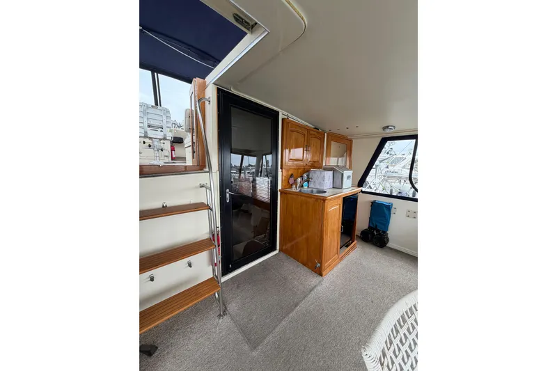 Slide: The Image of Interior of 1989 45' Californian Aft Cabin Motor Yacht with kitchenette and stairs. - 9