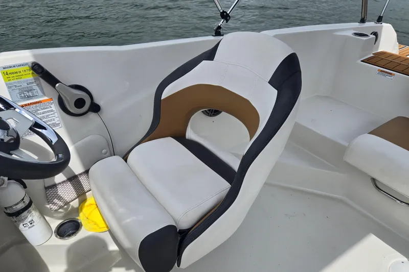Slide: The Image of Captain's seat on 2023 Starcraft SVX 210 DC OB boat, featuring ergonomic design. - 21