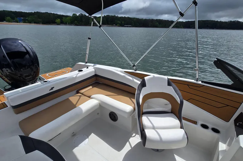 Slide: The Image of 2023 Starcraft SVX 210 DC OB boat interior with seating and water view. - 8