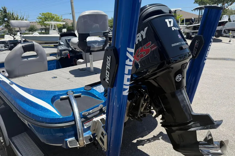 Slide: The Image of 2017 Nitro Z18 boat with Mercury Pro XS engine and Talon anchors in a sunny marina. - 4