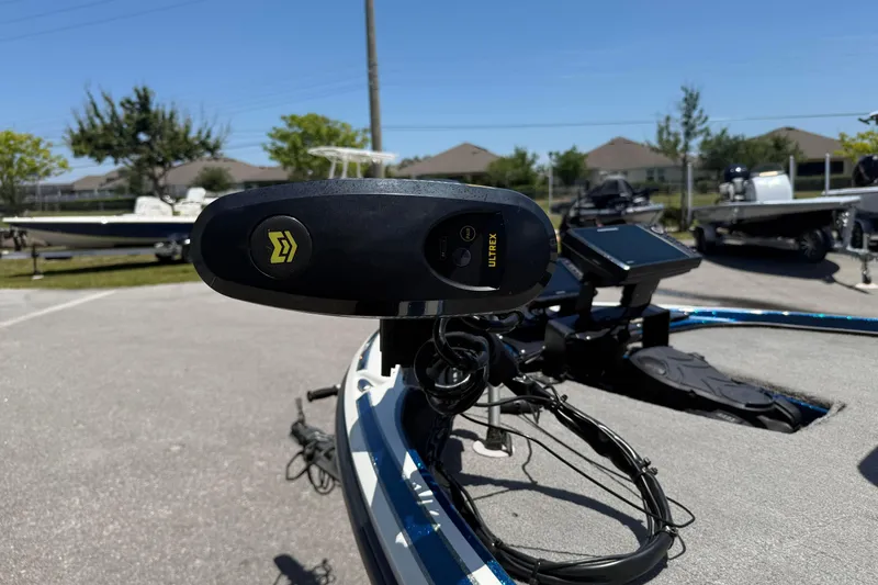 Slide: The Image of 2017 Nitro Z18 boat with Ultrex trolling motor in a sunny outdoor setting. - 7