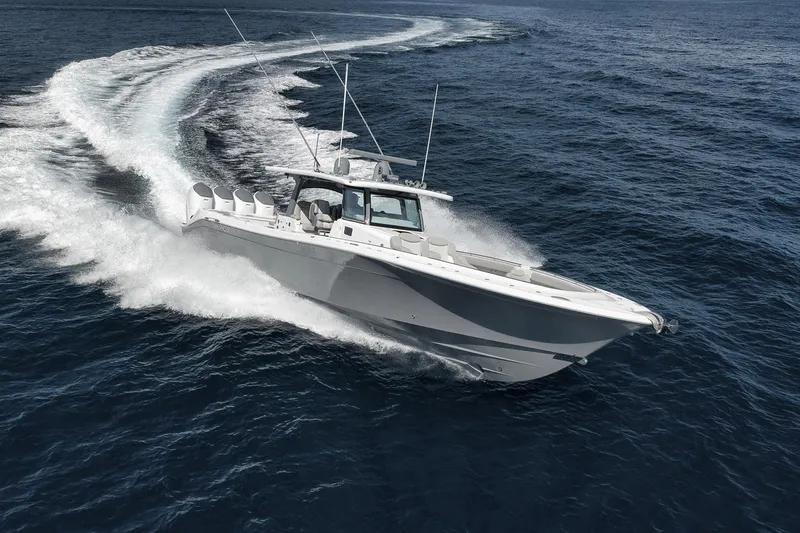Slide: The Image of 2025 HCB 53 Suenos boat cruising swiftly on open ocean waters. - 10