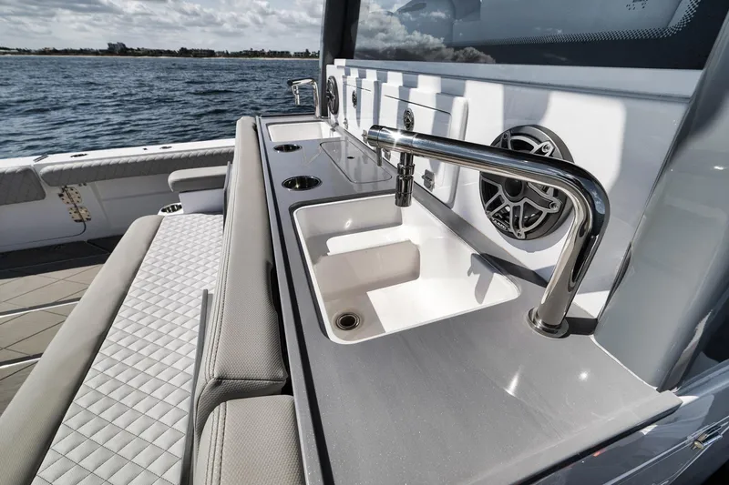 Slide: The Image of Luxury HCB 53 Suenos 2025 yacht with sleek sink and seating area on deck. - 20