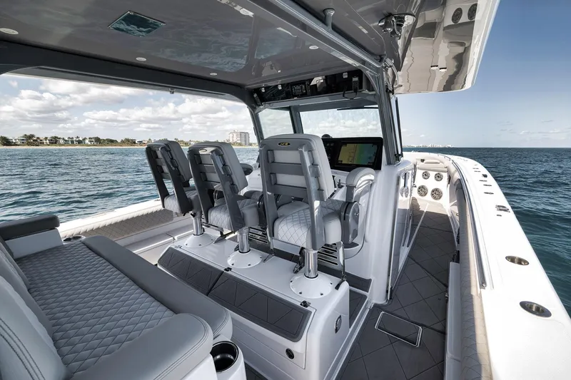 Slide: The Image of Luxurious 2025 HCB 53 Suenos boat interior with plush seating and advanced navigation system. - 24