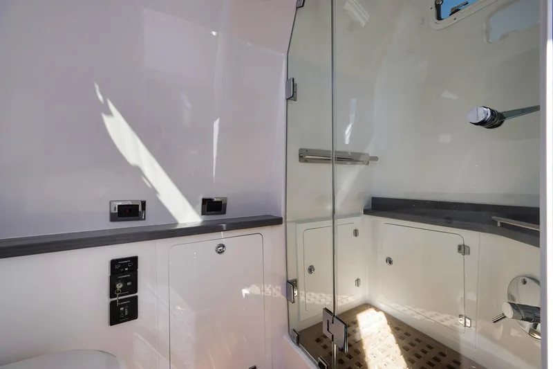 Slide: The Image of Luxurious bathroom interior of 2025 HCB 53 Suenos yacht with modern glass shower. - 27