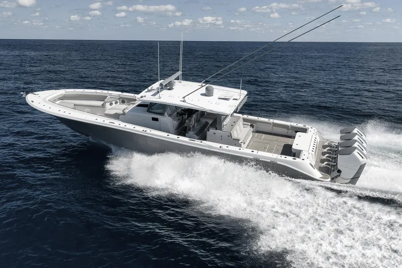 Slide: The Image of 2025 HCB 53 Suenos boat cruising on open ocean, showcasing powerful engines and sleek design. - 3