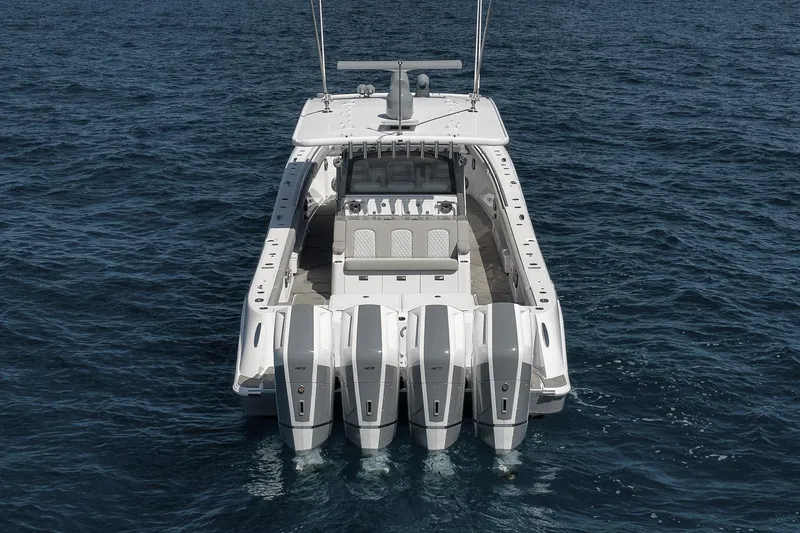 Slide: The Image of 2025 HCB 53 Suenos boat with four powerful engines on open water. - 4